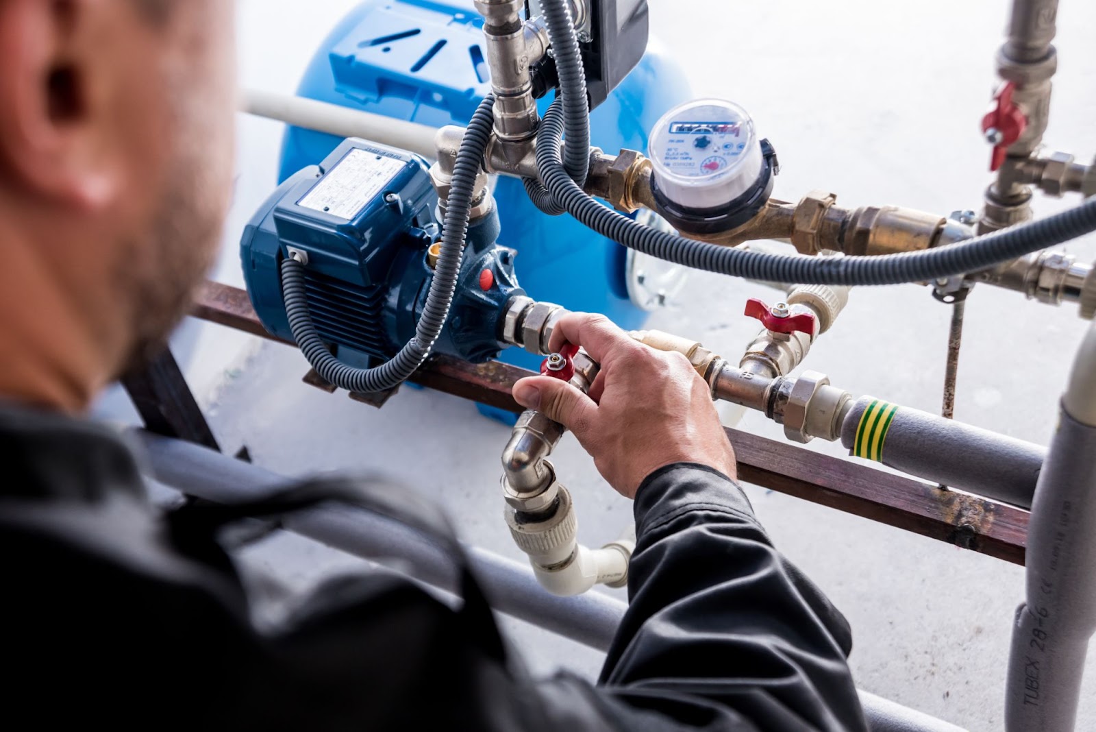 Plumber fixing pipe